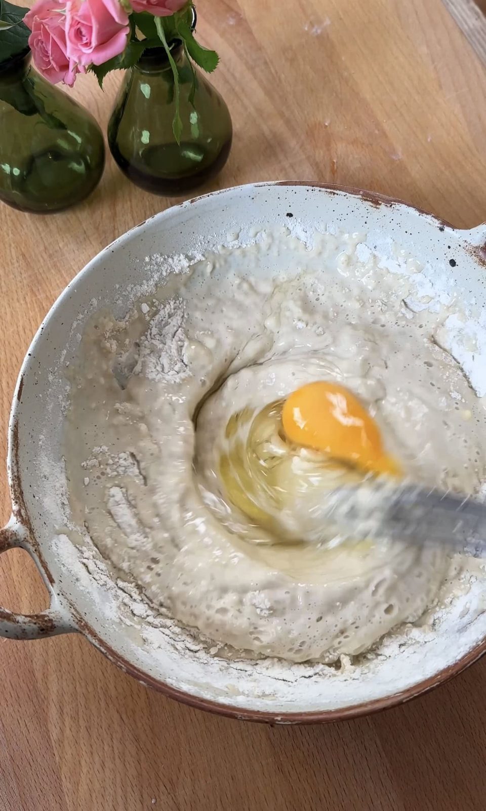 Mixing egg into the batter.