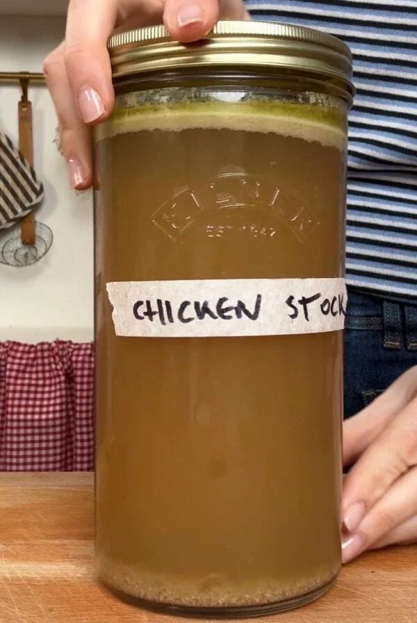 homemade chicken stock in a jar.