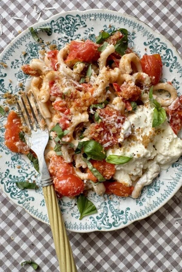 cherry pasta pasta sauce on a blue floral plate