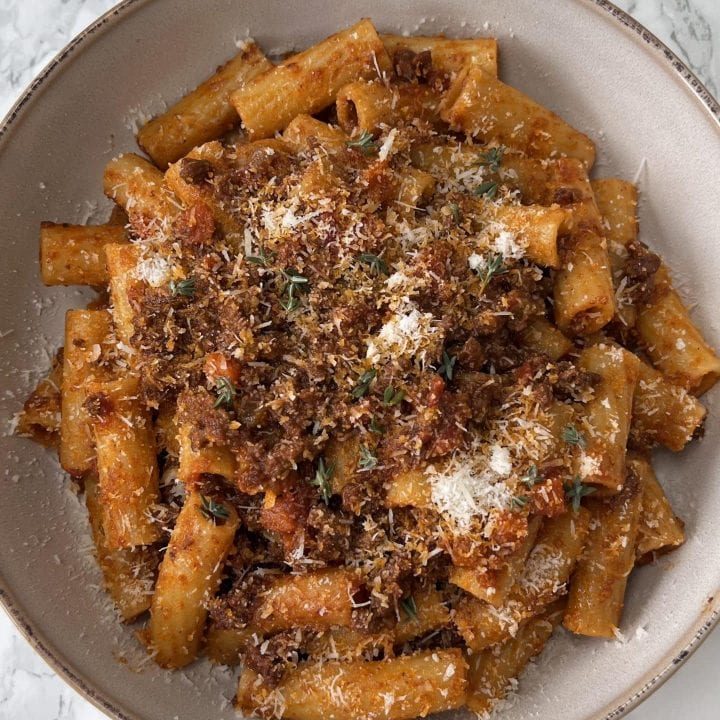 quick bolognese sauce with rigatoni 2quick bolognese sauce with rigatoni in a beige bowl