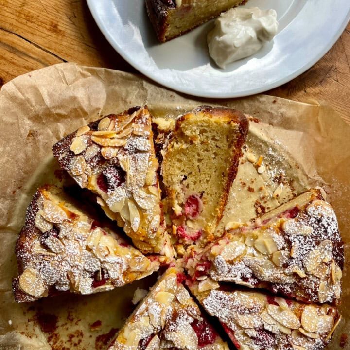 sliced Raspberry Almond and Ricotta Cake on a plate.