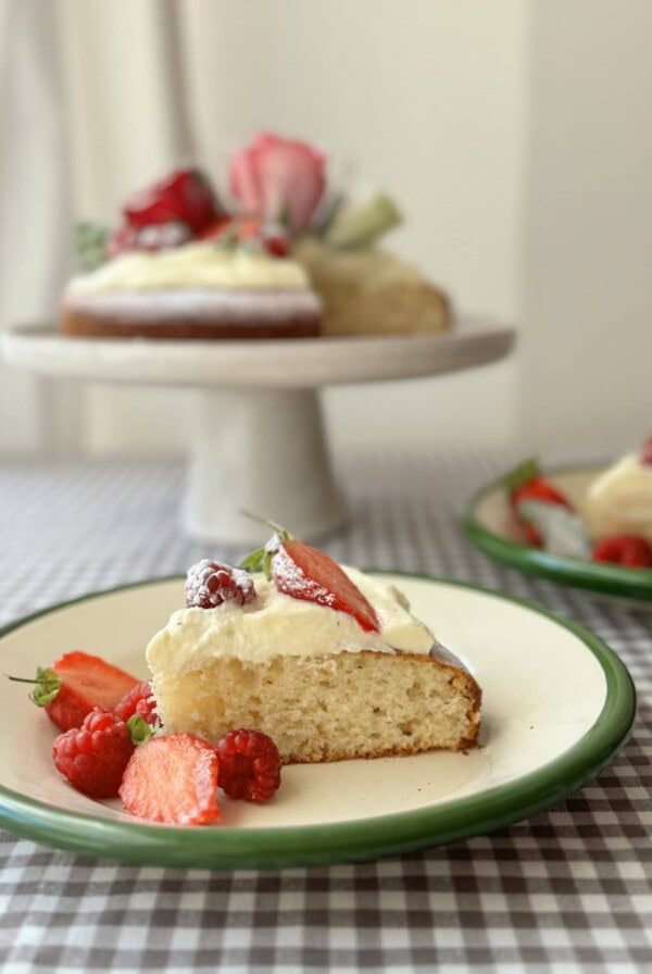 Gâteau au yaourt slice with cake behind on cake stand