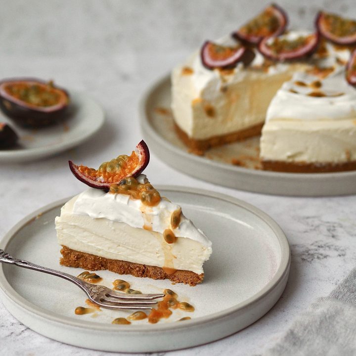 White Chocolate and Passion Fruit Cheesecake on a white plate in slices