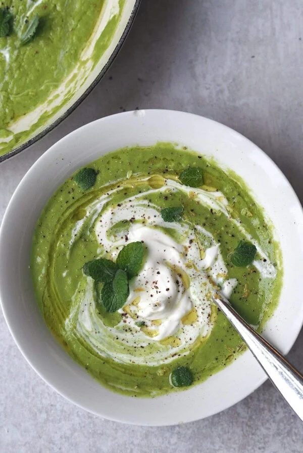 close up of little gem, pea, mint soup in a bowl