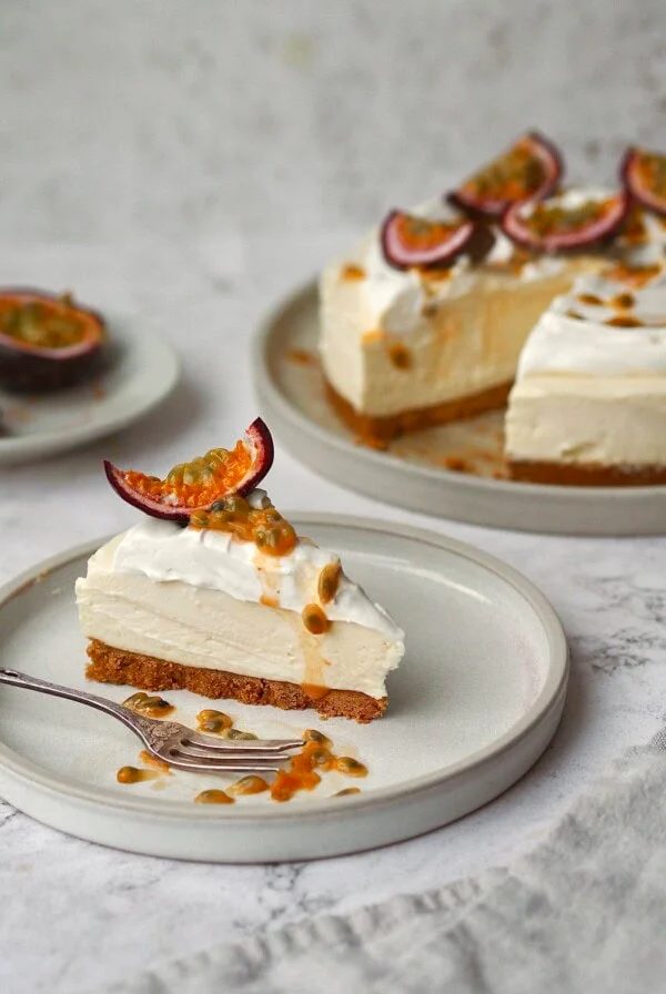 White Chocolate and Passion Fruit Cheesecake on a white plate in slices