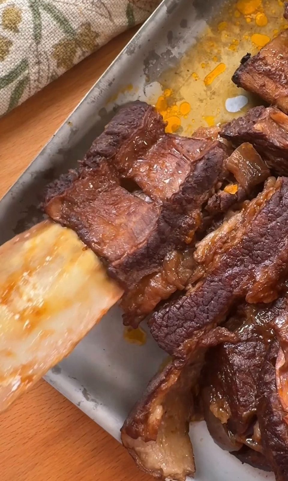 Pulling bones out of fall-apart tender short ribs.