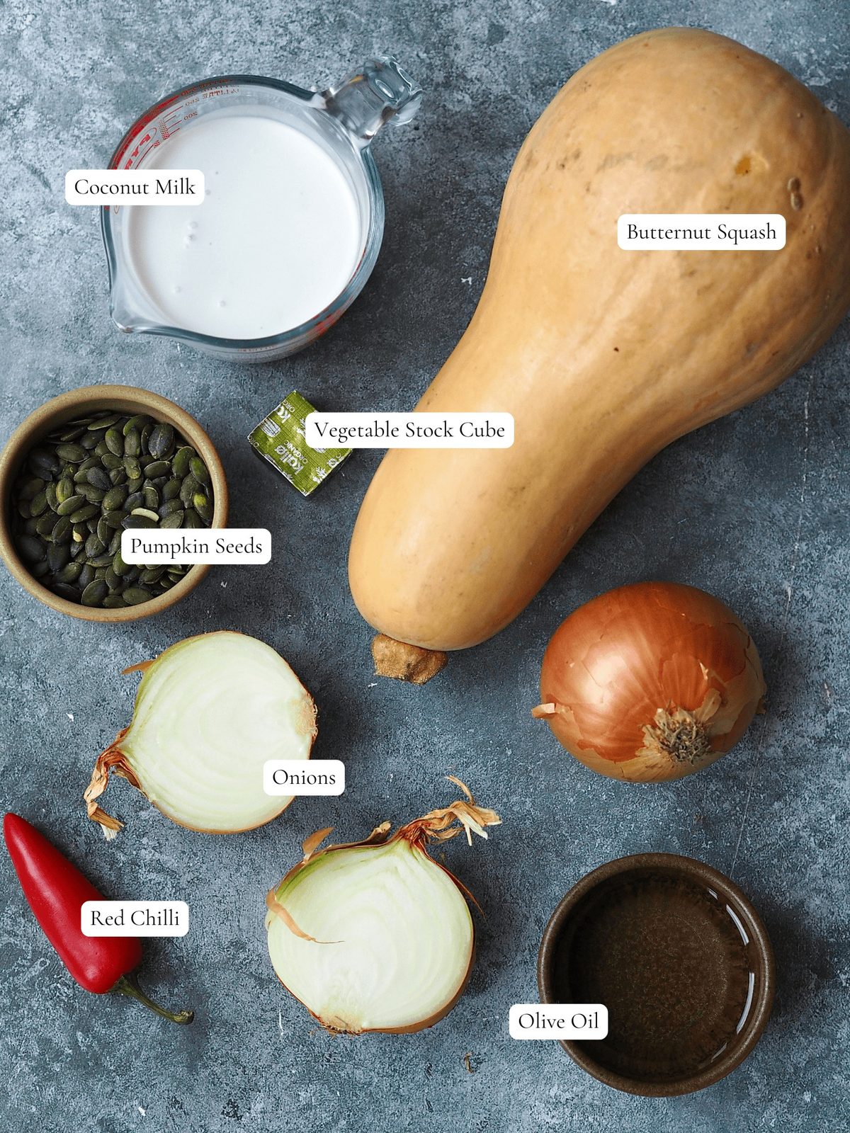 Butternut squash soup ingredients on a grey background.