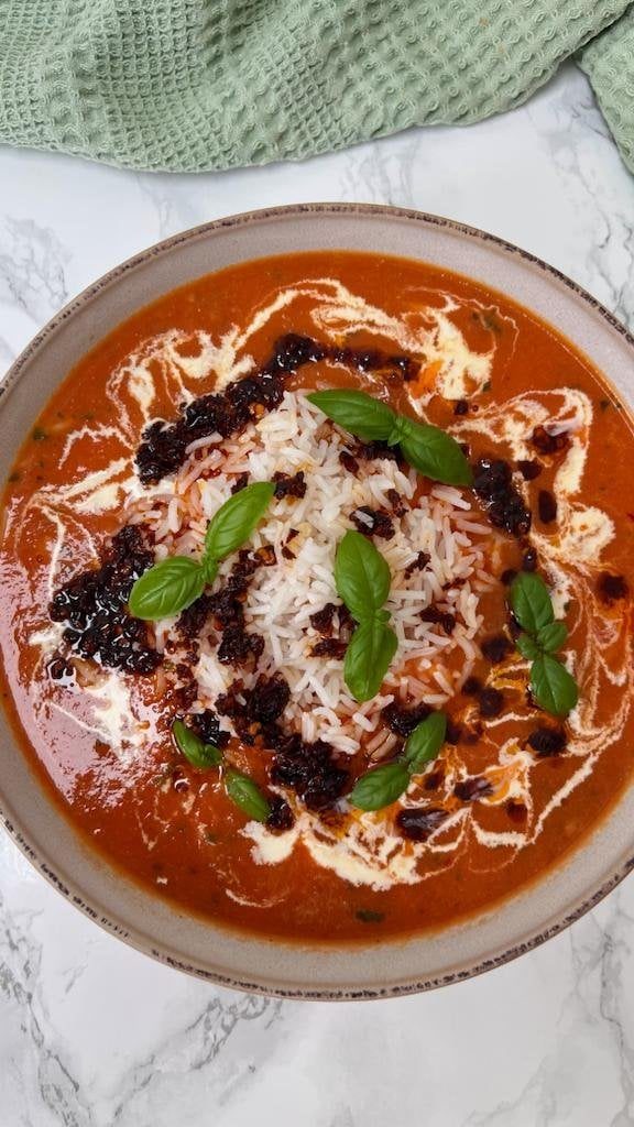 Roasted Fresh Tomato And Garlic Soup Over Rice