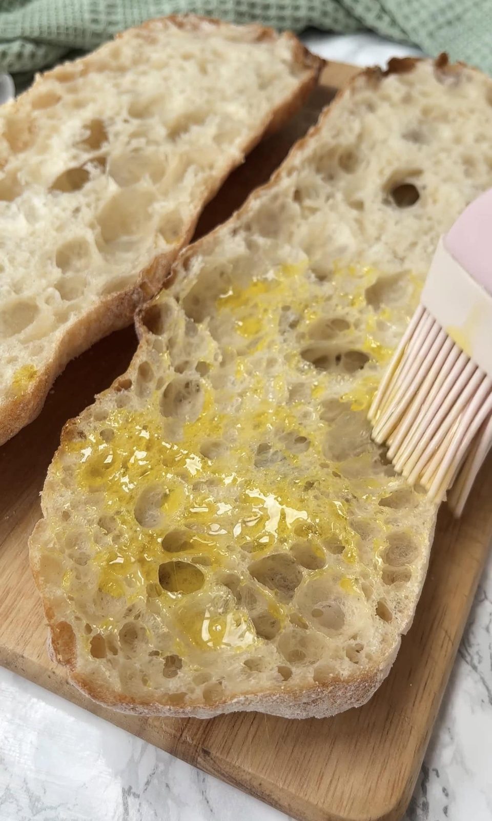 brushing bread with olive oil.