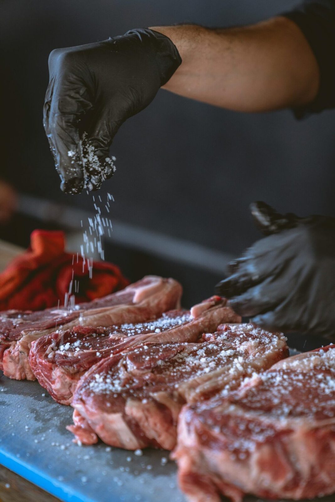 seasoning rump steak.