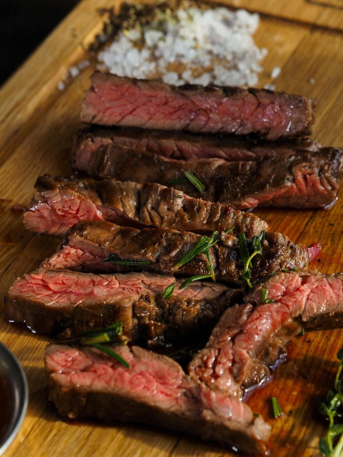 rump steak sliced on a wooden board.