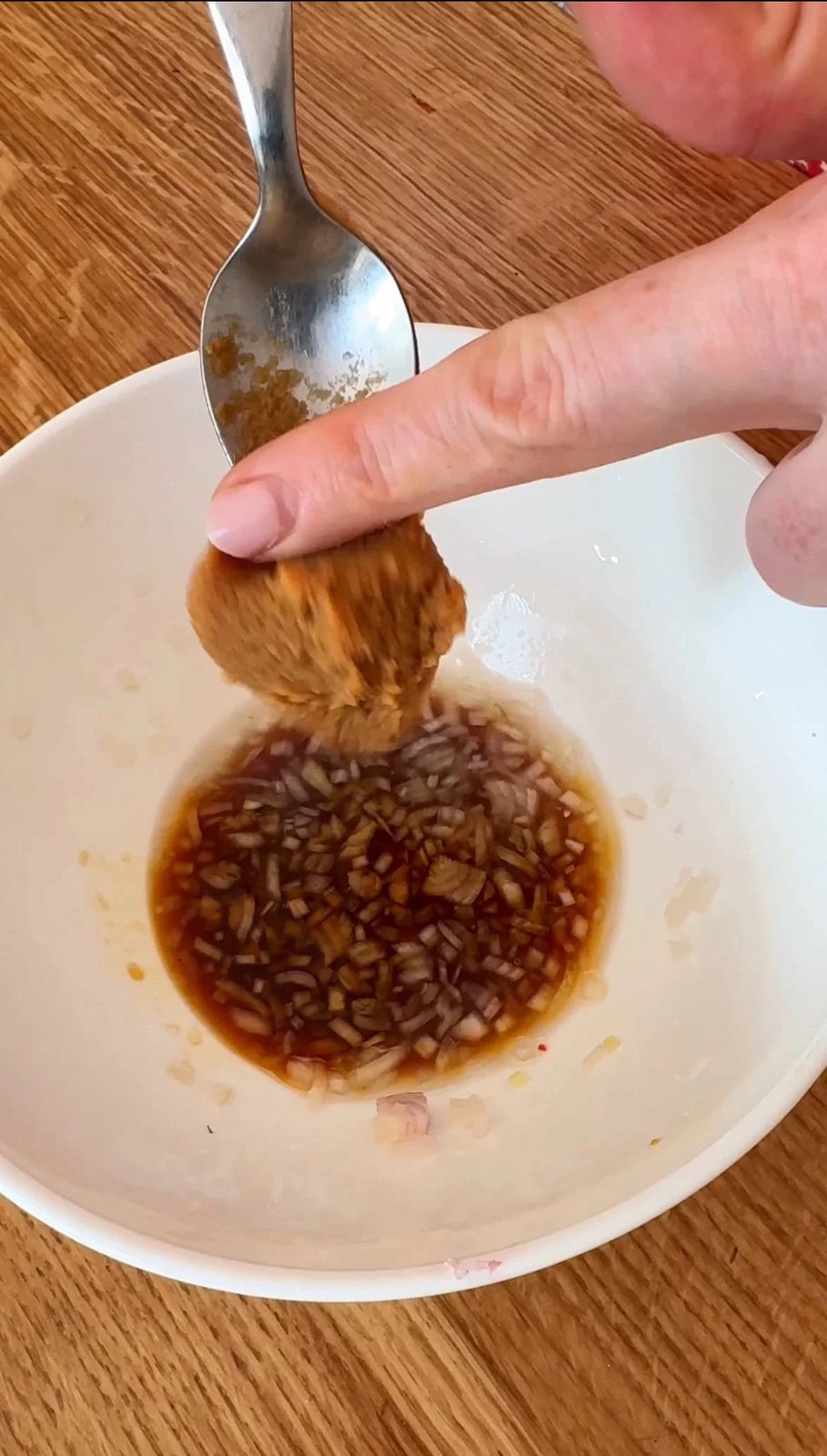 adding miso to salmon crudo dressing.