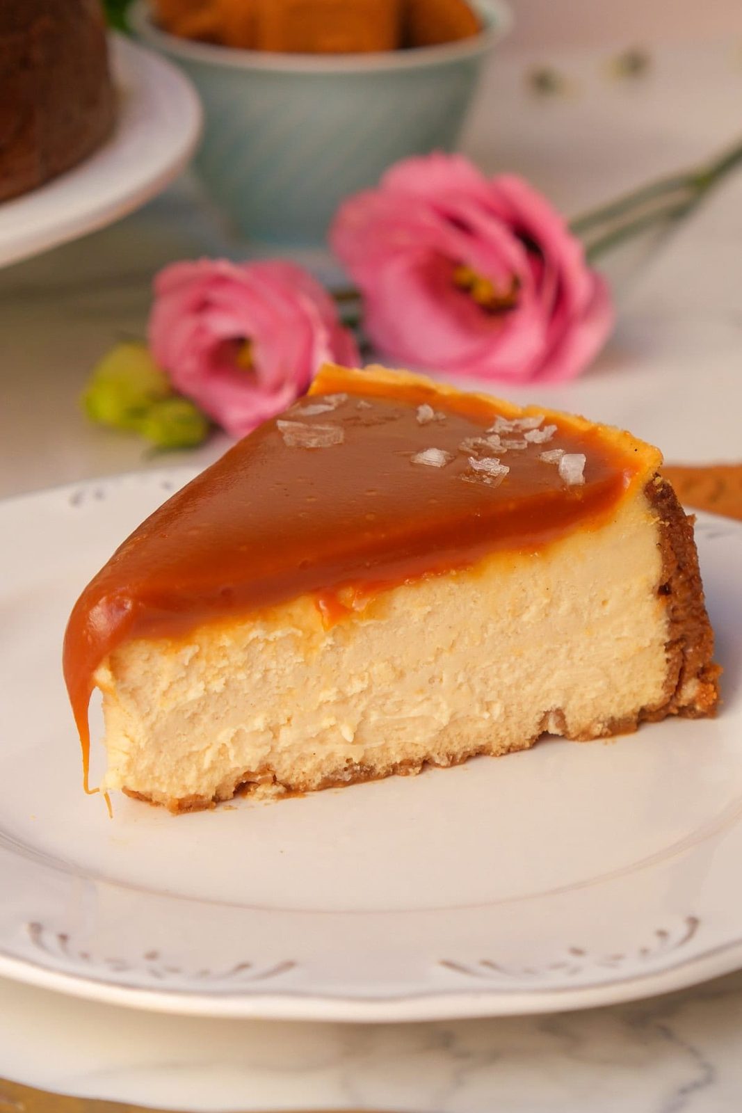 salted caramel cheesecake on a white plate.