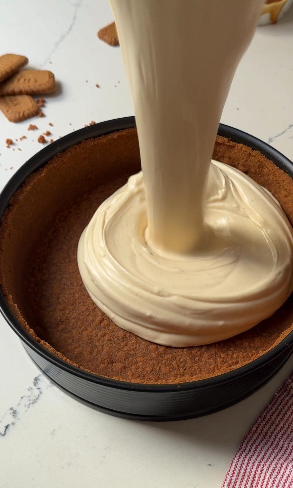 filling the cheesecake with salted caramel cheesecake mix.