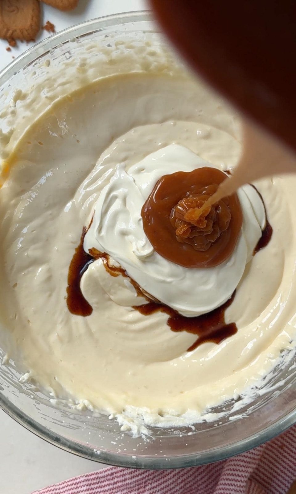 folding salted caramel into cheesecake mix.