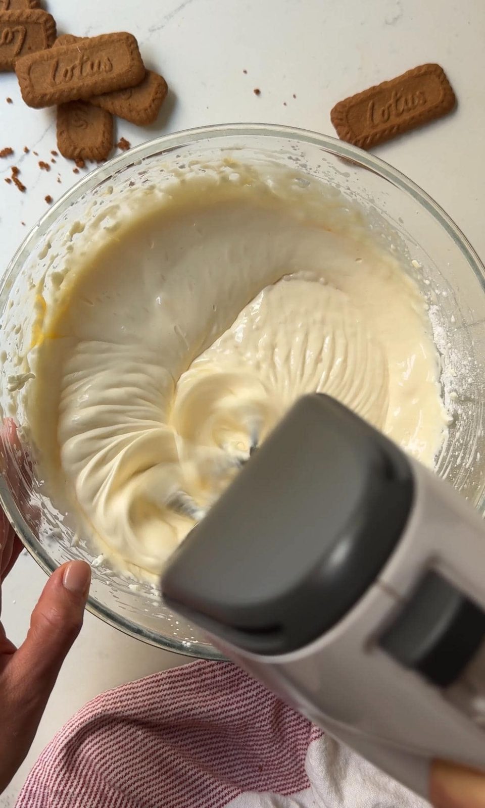 beating the cheesecake mix together.