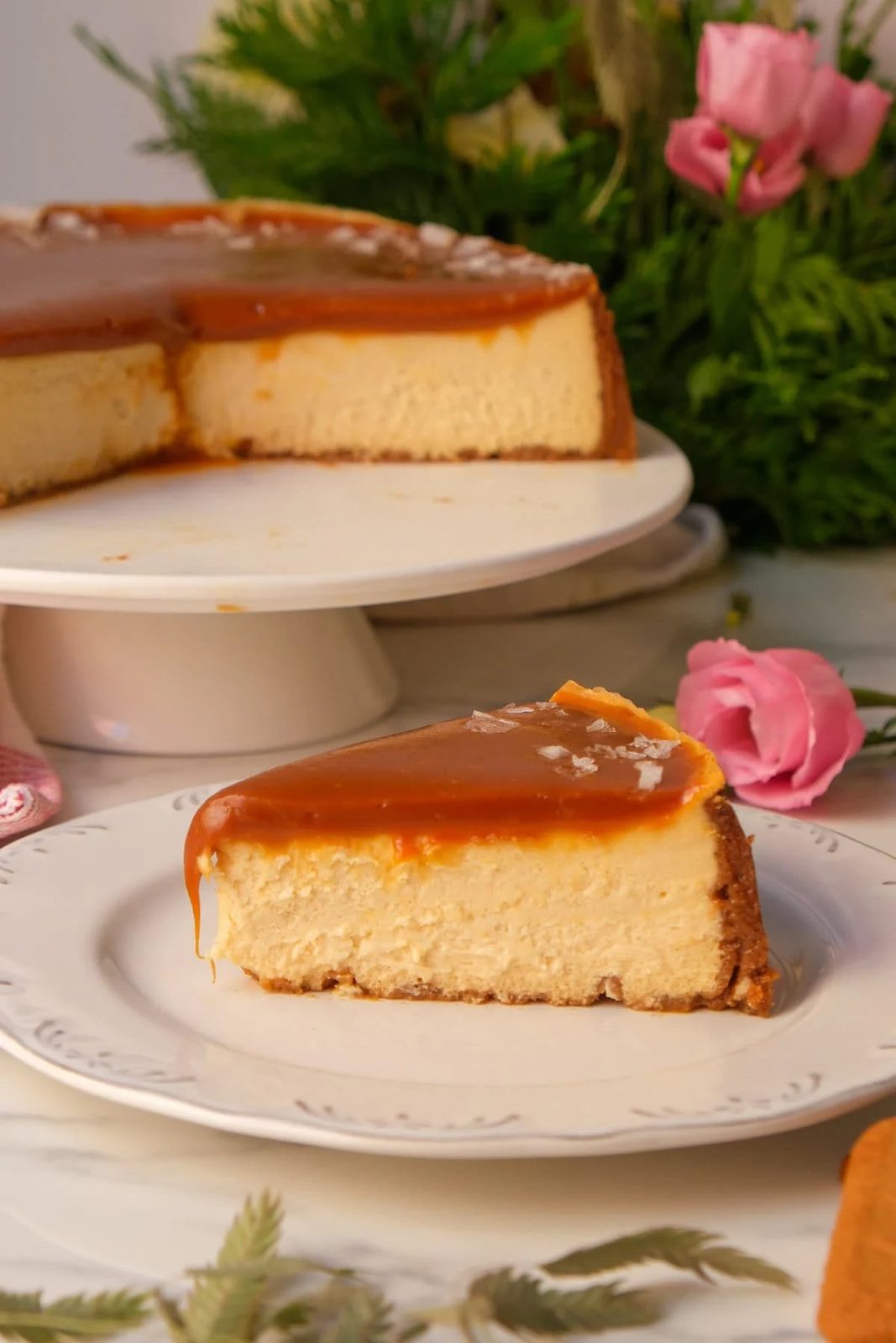 salted caramel cheesecake on a white plate.