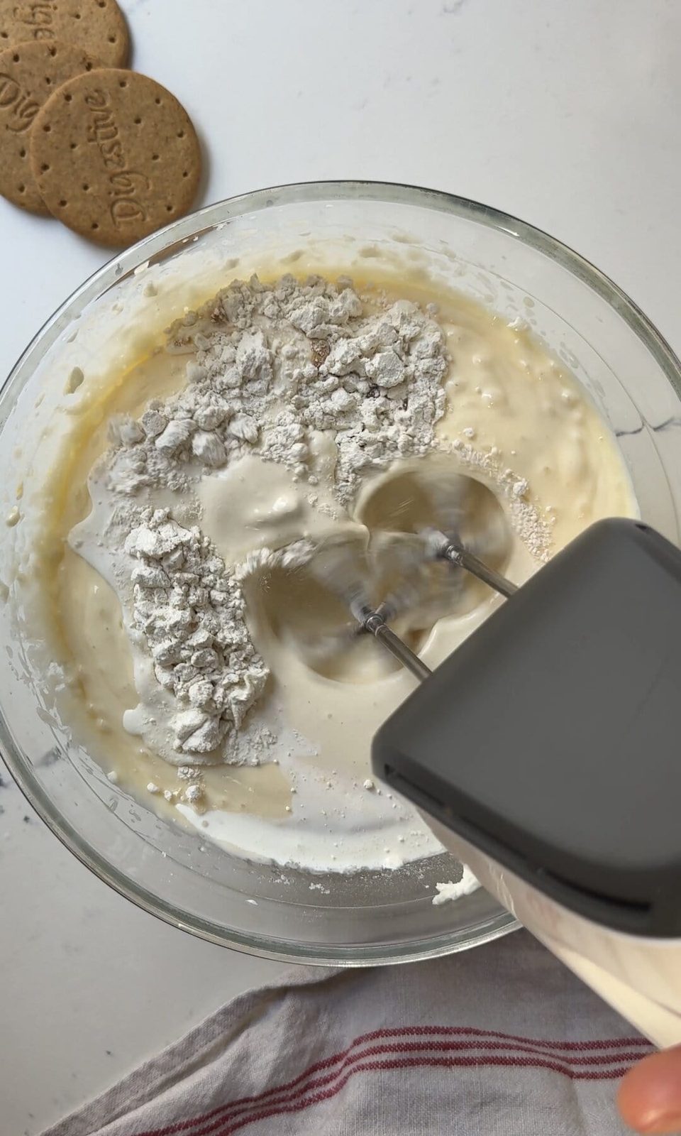 adding flour to san sebastian cheesecake base.