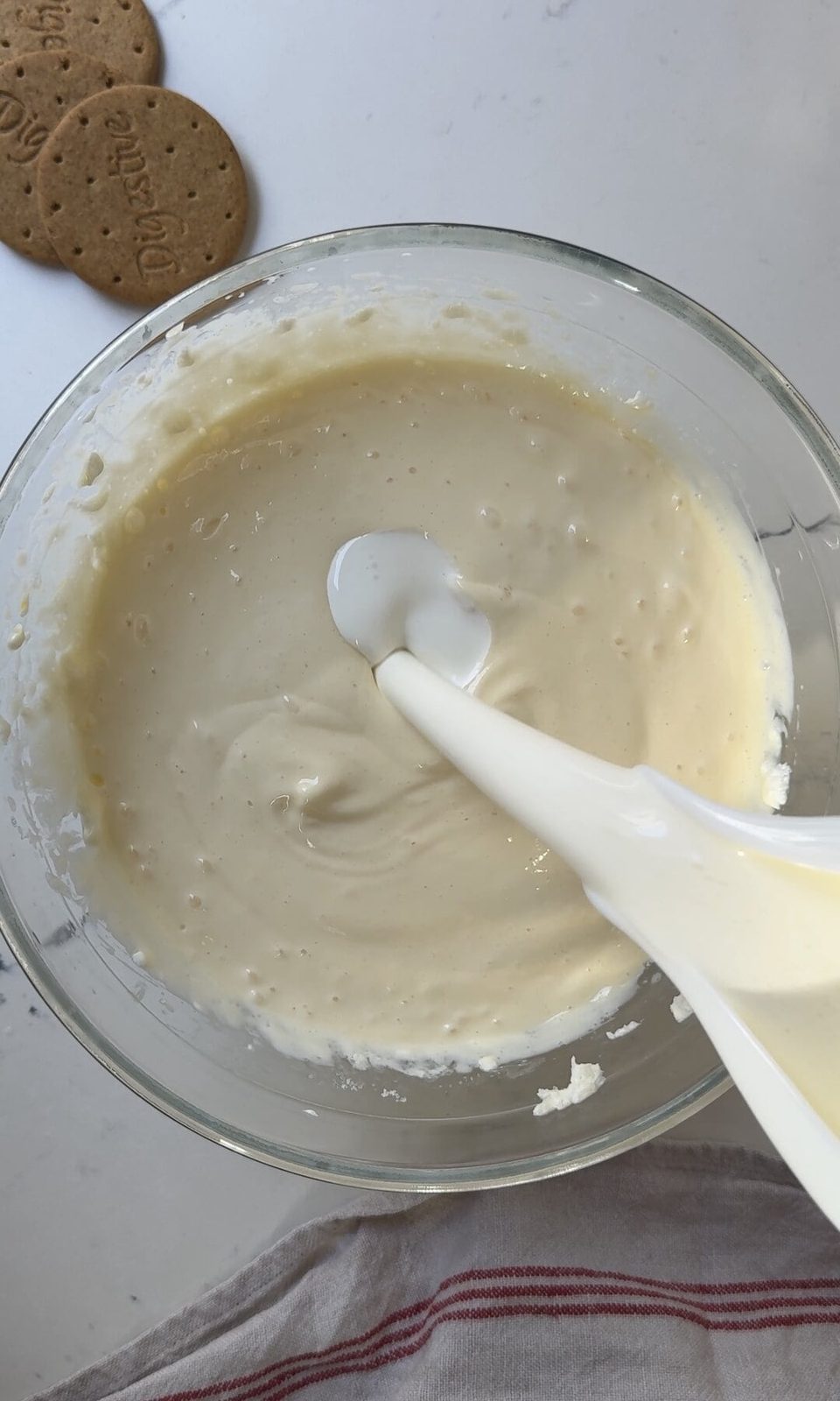adding double cream to cheesecake base.