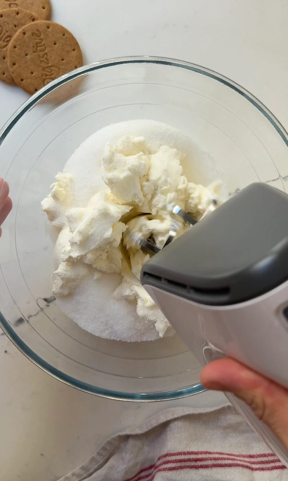 whisking cream cheese and sugar.