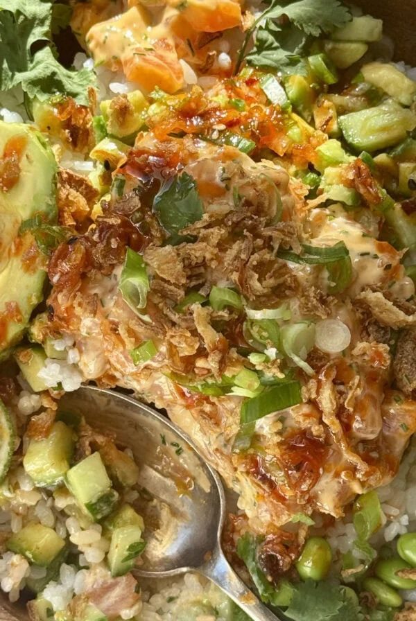 salmon bowls with sushi rice, lime and spring onion.