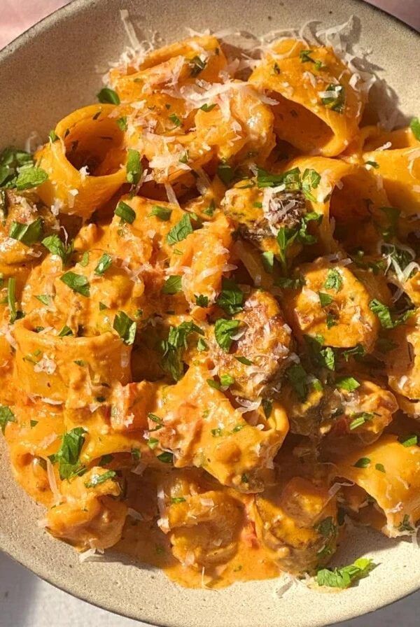prawn chorizo pasta in a beige bowl.