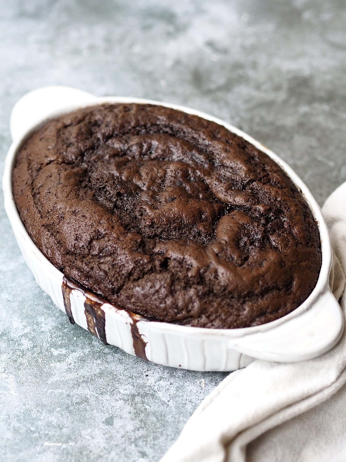 baked Self Saucing Chocolate Pudding in a white baking dish.