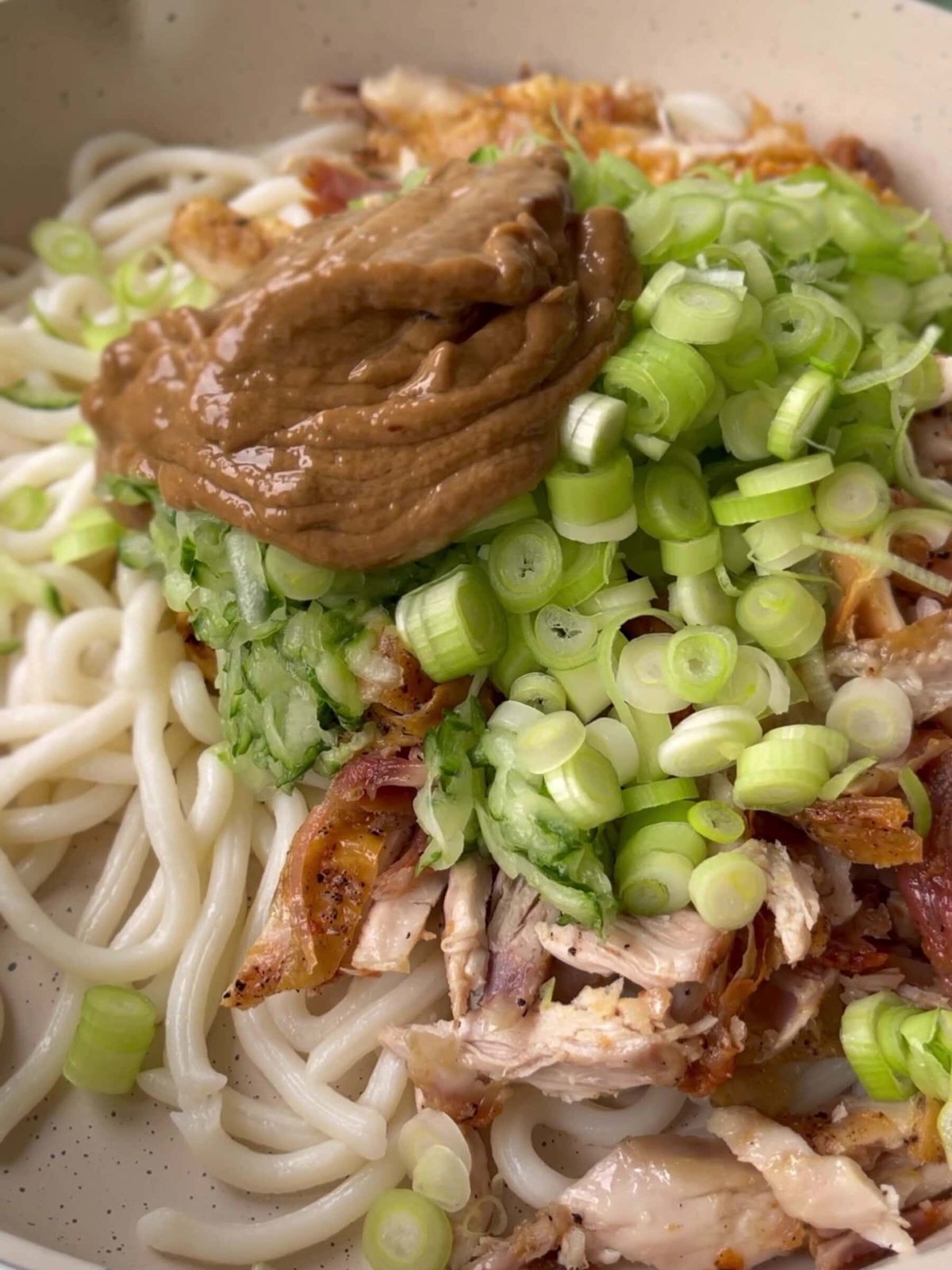 Assembling cold Noodle Salad with Chicken .