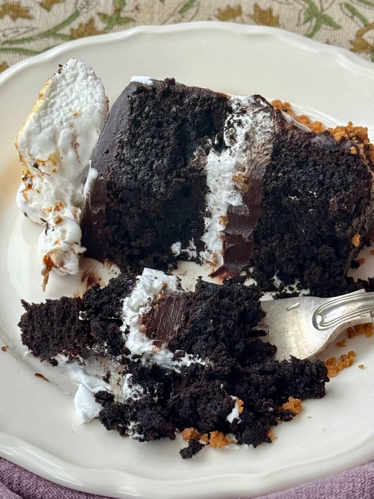 slice of s'mores cake on a plate.