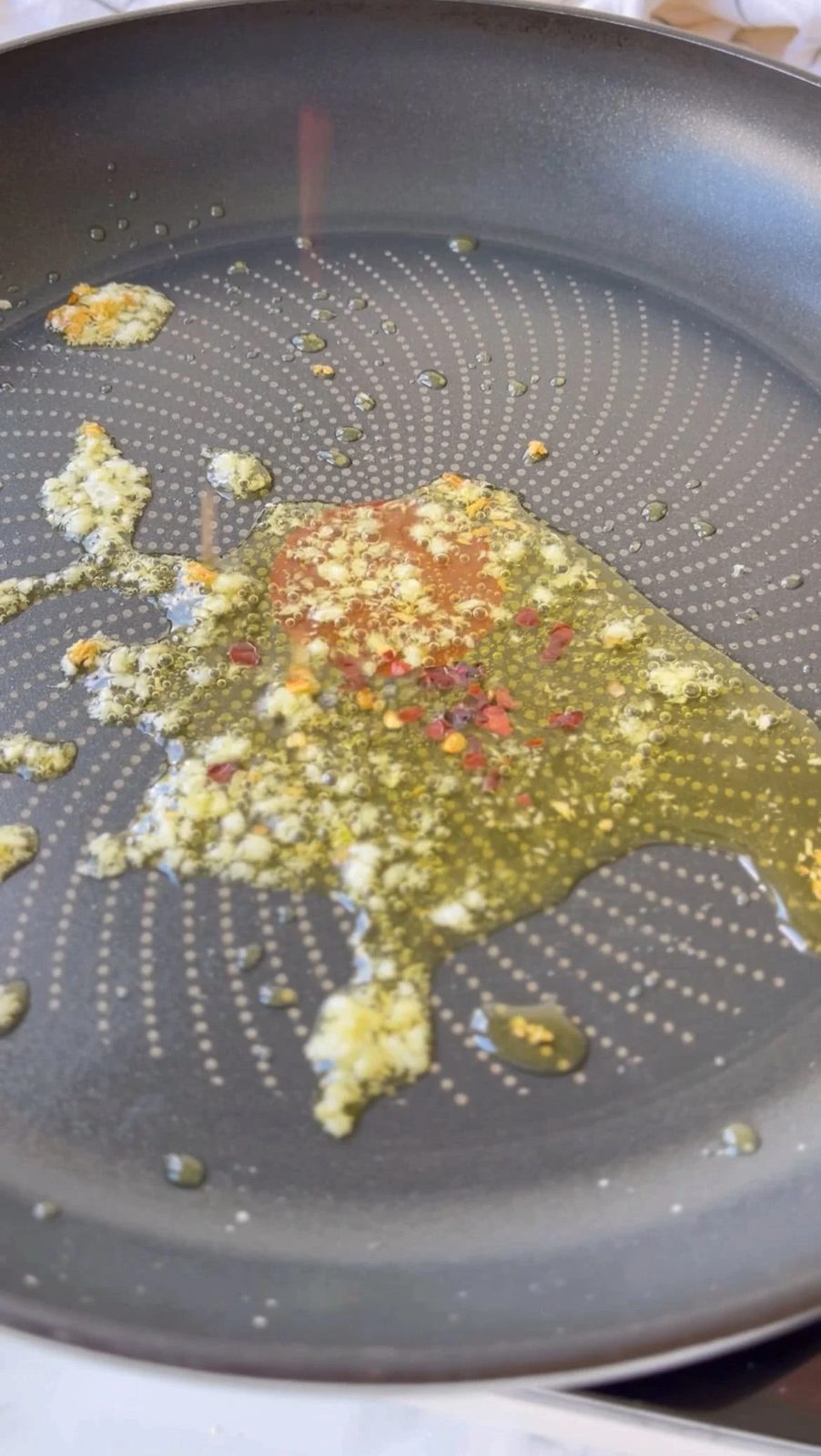 frying garlic and chilli flakes in olive oil