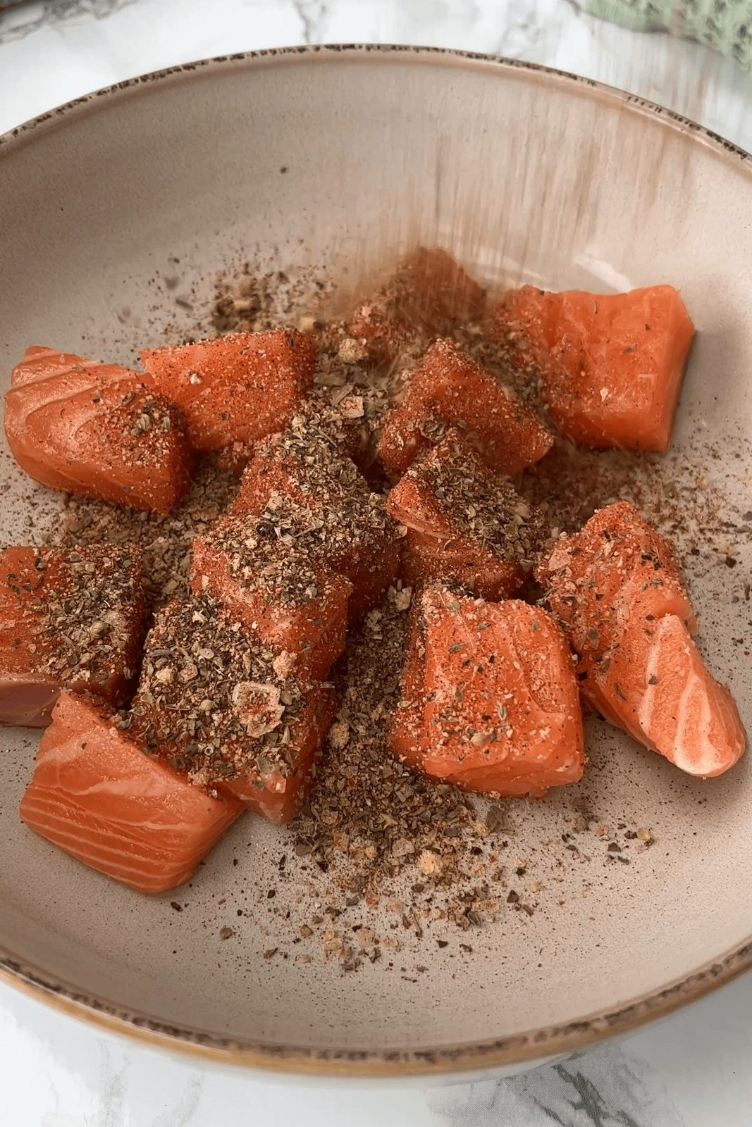 seasoning the spicy salmon.