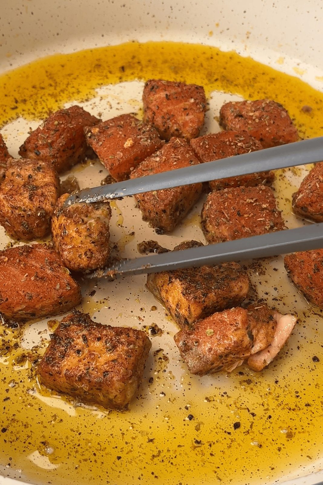 frying the salmon chunks.