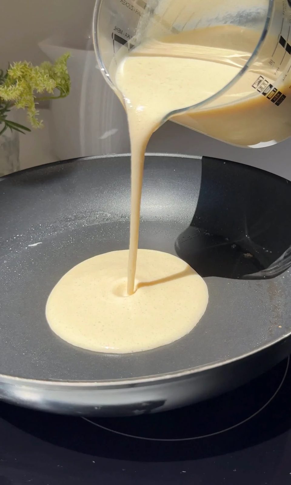 pour crepe batter into the pan.