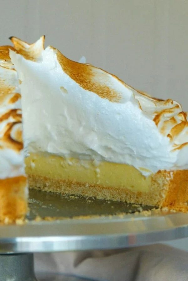 lemon meringue tart with slice removed.
