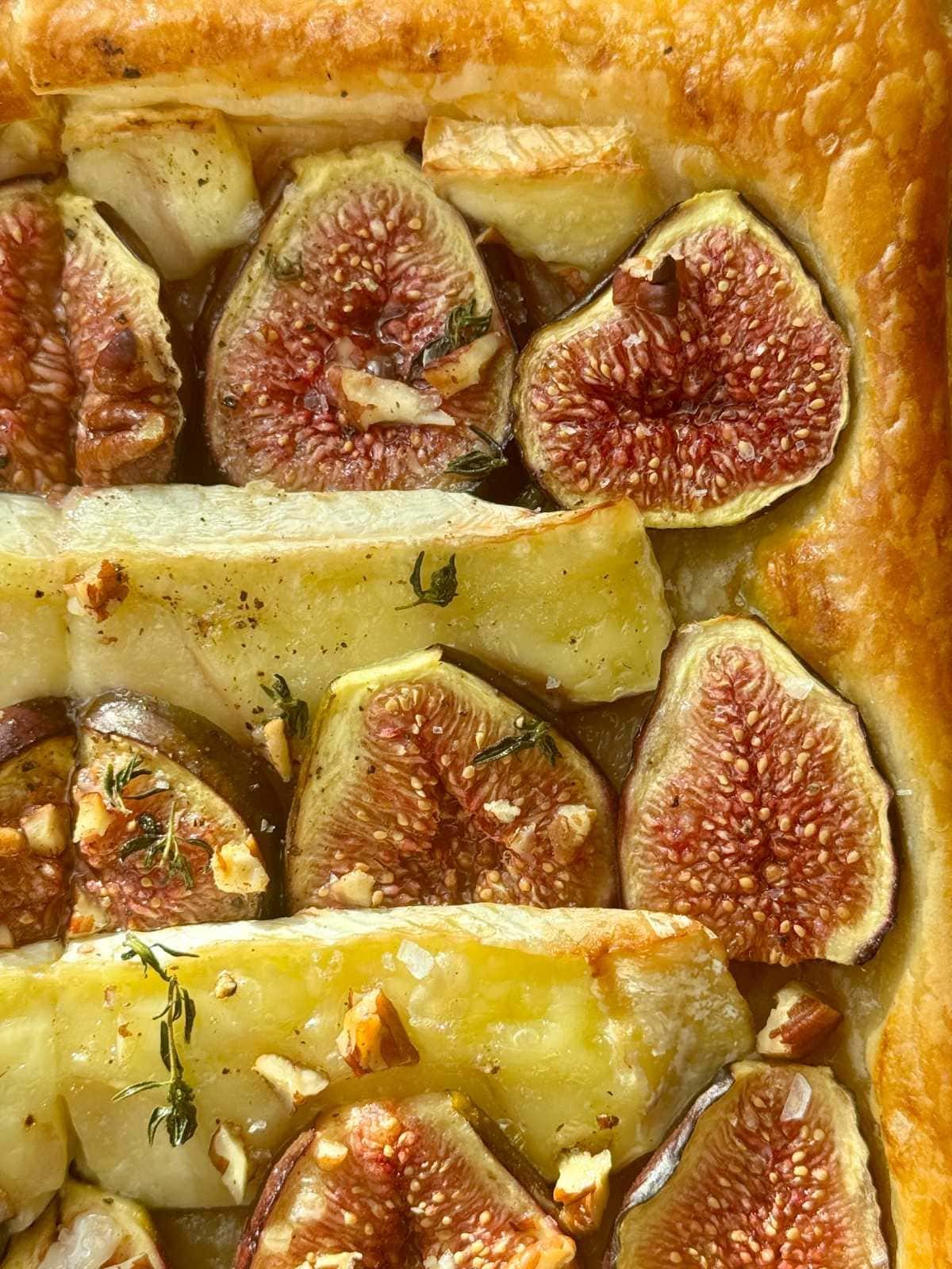 fig and brie tart on parchment paper.