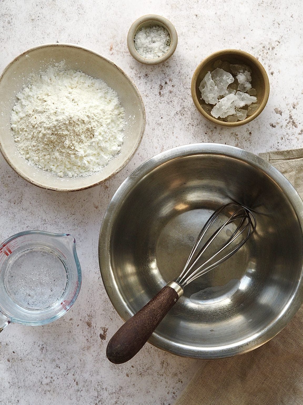 Ingredients and equipment to make tempura batter on the countertop.