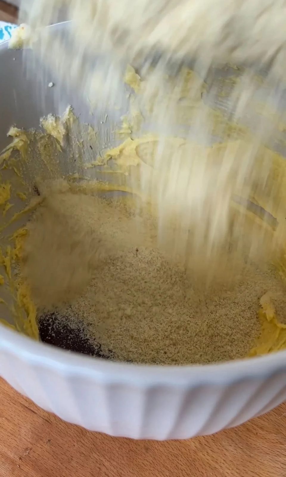 adding ground almonds to torta caprese.