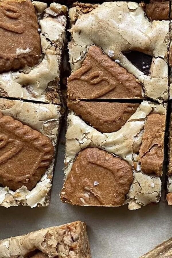 biscoff blondies sliced on parchment paper.