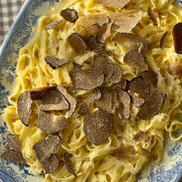 truffles with pasta on a plate.