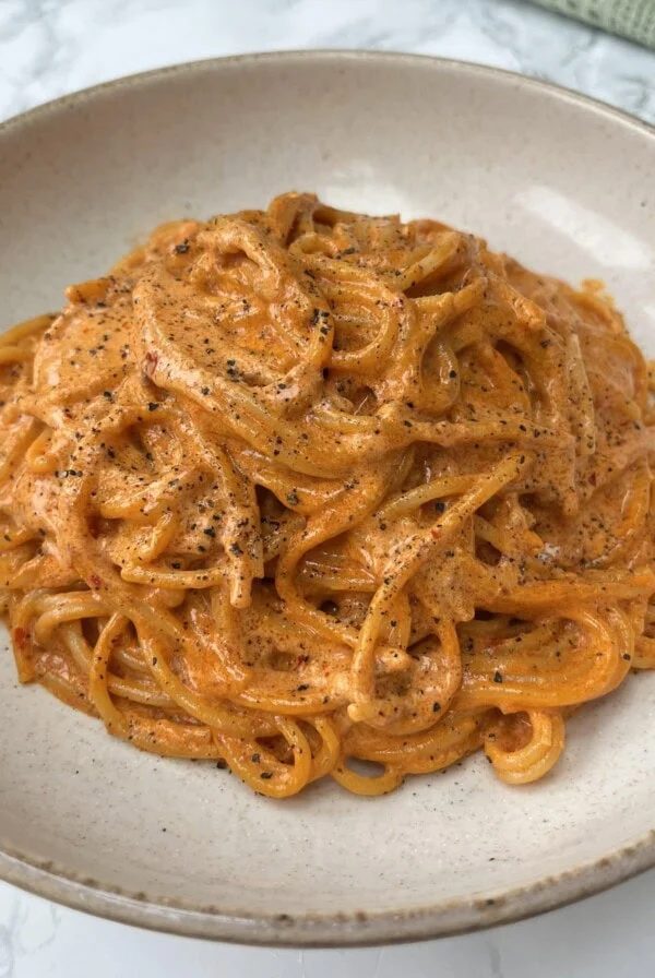 Spicy Nduja Pasta on a beige bowl