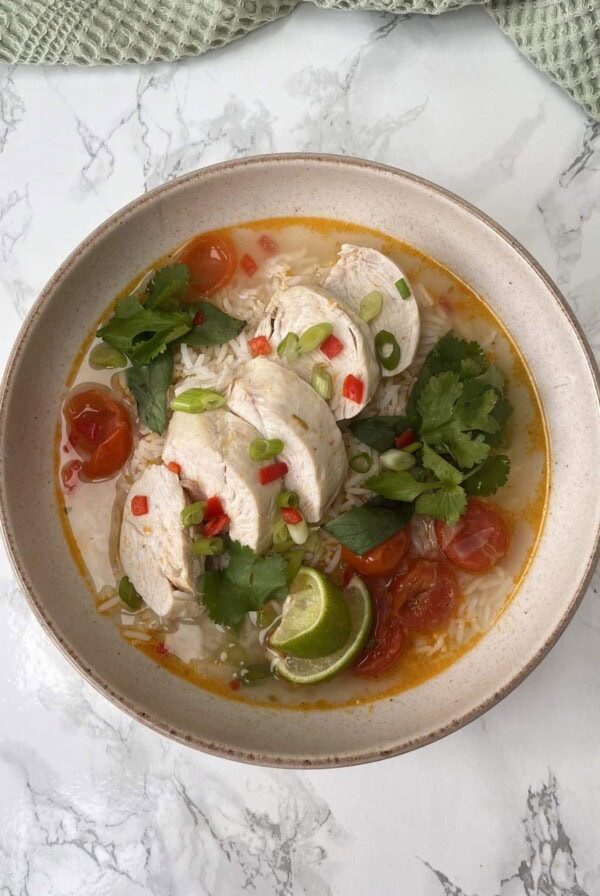 Thai Chicken Soup With Rice in a beige bowl