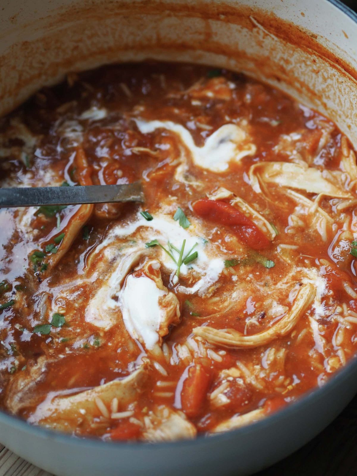 Adding cream to the soup