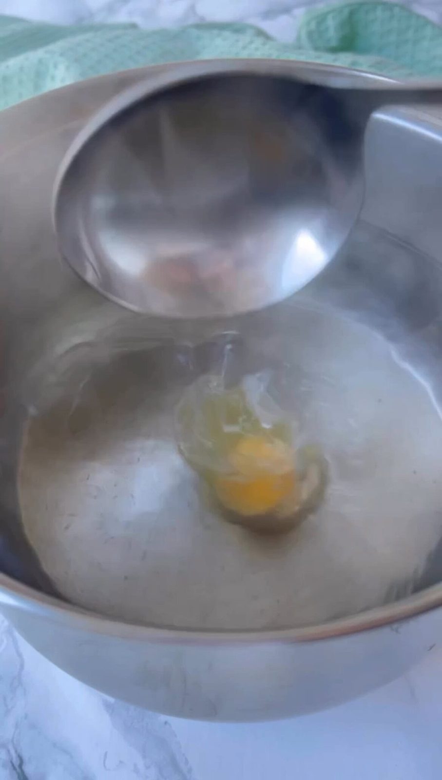 Poaching an egg in water