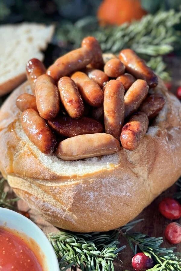 Sticky sausages in a bread bowl.