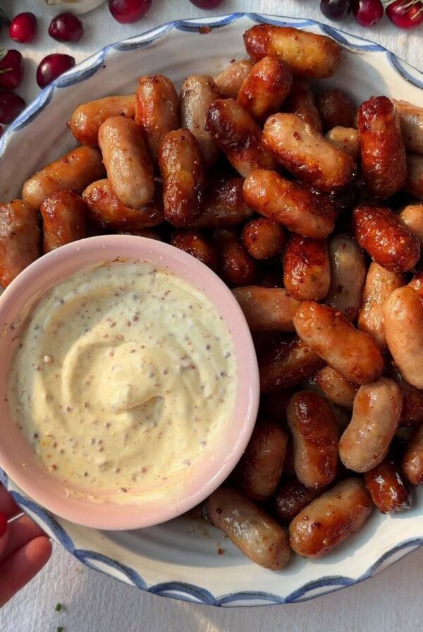 Honey Mustard Sausages in a bowl with a dip