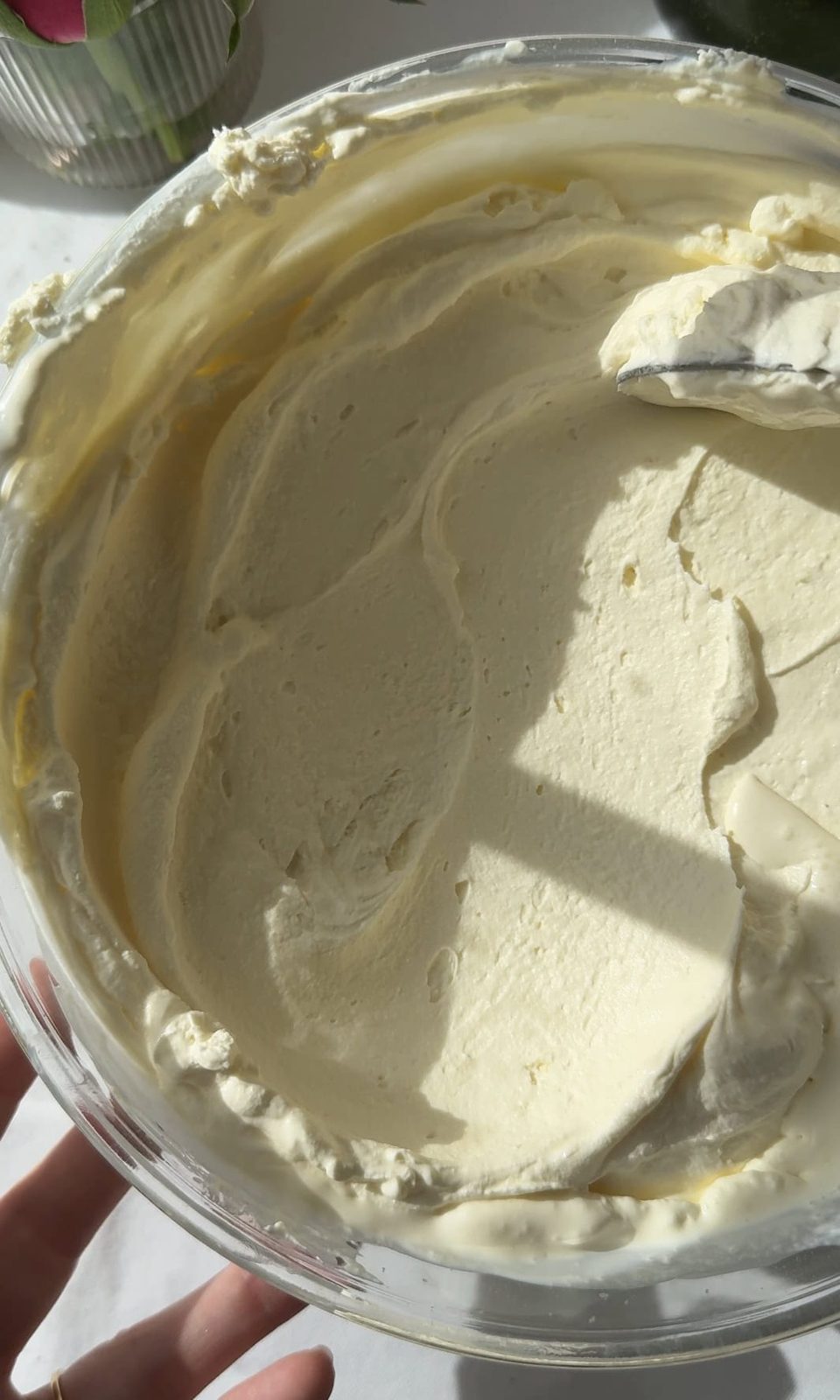 Whipped mascarpone cream in a bowl.