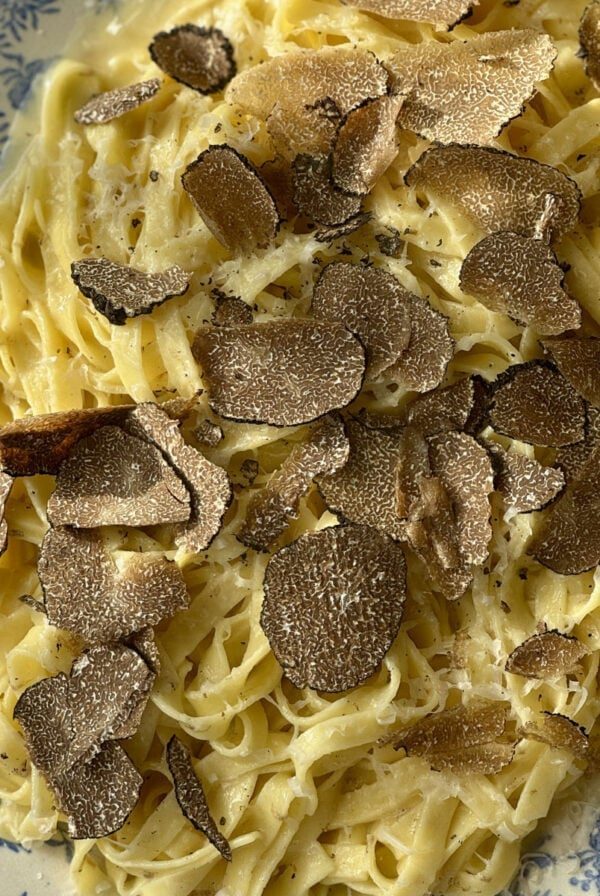 truffles with pasta on a plate.