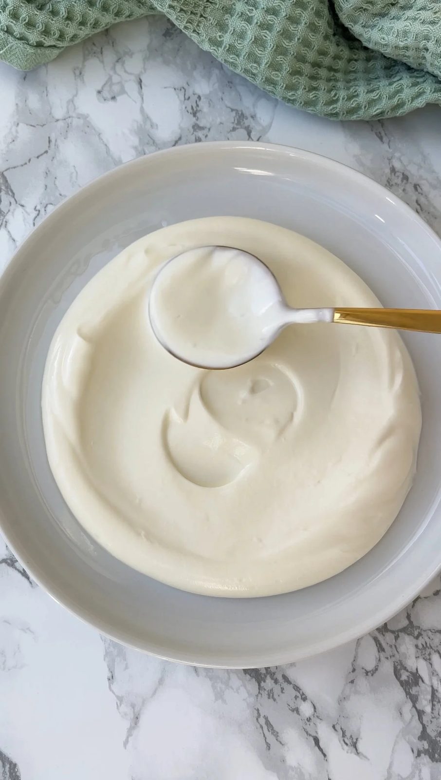 smoothing greek yoghurt base on to the plate.