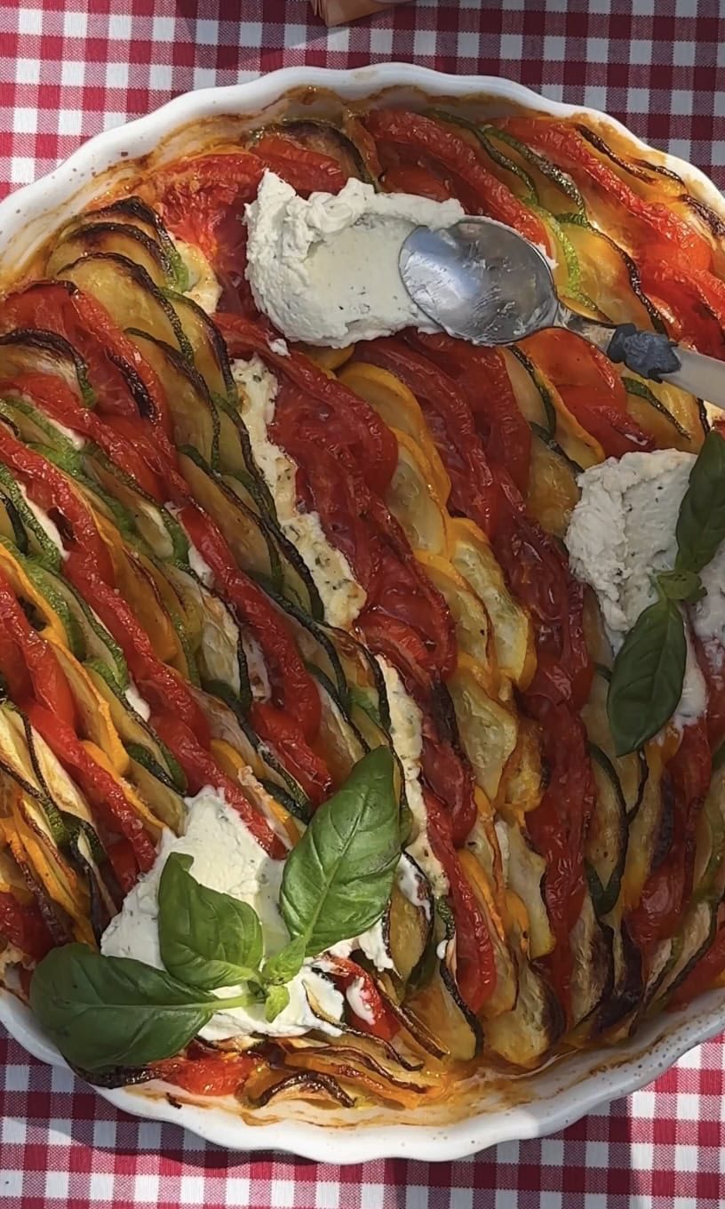 smoothing whipped boursin on the zucchini al forno.