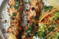 Tender Baked Chicken Skewers with Zesty Herb Drizzle, Crisp Salad and Cooling Raita